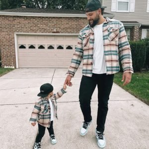 Father and son wearing matching MANCUB checked flannel jackets